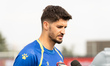 Nikola Vasilj #01 of the Bosnia and Herzegovina national football team speaks to the media...
