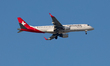 An HB-JVP Helvetic Airways Embraer ERJ-190 aircraft flies over the match venue ahead of th...