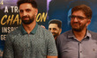 Ghulam Nabi Dar (left), father of Auqib Nabi Dar, attends a ceremony where the district ad...