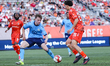 Halifax defender Finn Linder (left) marks a Forge FC forward during a Canadian Premier Lea...