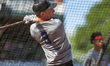 Kyle Schupmann of the Williamsport Crosscutters warms up before an MLB Draft League baseba...