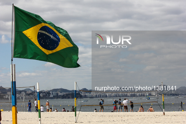 Rio de Janeiro, Brazil, 11 August 2016: Movement of swimmers and fans in Flamengo Beach on the south side of Rio de Janeiro. With the sailin...