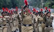NCC students, Armed Police forces and other civilians march past as they rehearsal in the...