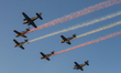 Members of the Indonesian Navy's Rajawali Laut Flight Team perform an aerobatic display du...