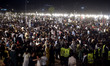 People attend the Shaheed-e-Ummat Conference at Minar-e-Pakistan in Lahore, Pakistan, on J...