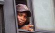 A commuter observes as civil society groups hold a protest regarding governance, security,...