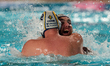 Alejandro Bustos Sanchez (left) of Zodiac CNAB celebrates with a teammate after winning th...