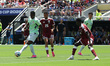 Breel Embolo of Switzerland is challenged by Mohamed Manai of Qatar during the FIFA World...