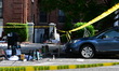 NYPD officers work at the scene where 44-year-old Emanuel Spencer was fatally shot multipl...