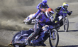 Alfie Bowtell of Buxton Bulls in red leads Dayle Wood of Edinburgh Monarchs Academy in yel...