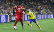 Yan Valery of the Tunisia national team and Gabriel Gudmundsson of the Scotland national t...