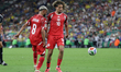 Elias Saad #8 and Hannibal Mejbri #10 of the Tunisia national team are seen after a play d...