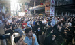 Iranian families watch a soccer match between Iran and New Zealand during their team's fir...