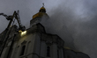 Firefighters extinguish a fire at the Dormition Cathedral in Kyiv's UNESCO-listed Kyiv Pec...