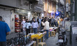 People walk past sidewalk vendors in downtown Tehran, Iran, on June 15, 2026. The United S...