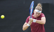 Marie Bouzkova of the Czech Republic competes during the round of 16 doubles match at the...
