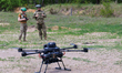 Servicemen prepare a drone during training at the Rarog training center of the 427th Separ...