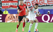 Stefan Posch of Austria competes with Mohannad Abutaha of Jordan during the FIFA World Cup...