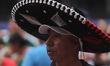 A fan of the Mexico national team attends the Mexico FIFA Fan Fest in the main square Zoca...