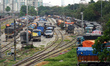 Trucks park inside a railway yard for unloading in Kolkata, India, on June 18, 2026. 