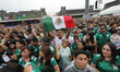 People attend the Mexico FIFA Fan Fest in the main square Zocalo to support the Mexico nat...