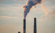 Pollution and steam rise from the stacks of the Miami Fort Power Station situated along th...