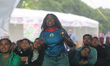 A Haitian woman reacts while watching the FIFA World Cup first-round match between Haiti a...