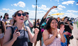 Onlookers scream and shout from the sidelines during the 44th Annual Coney Island Mermaid...