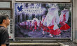 NACHIKATSUURA, JAPAN - JUNE 19: 
A traveler walks past a large billboard showcasing tradi...