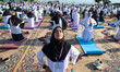 People perform yoga during International Day of Yoga in Srinagar, Jammu and Kashmir, on Ju...