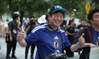 Fans of the Japan national team attend the Monterrey Stadium to support their team during...