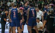 Pelita Jaya Jakarta players and coaching staff gather to discuss strategy during a timeout...