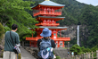 NACHIKATSUURA, JAPAN - JUNE 19: 
Tourists photograph the three-story vermilion pagoda of...