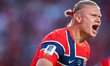 Erling Haaland of Norway celebrates after scoring the first goal during the FIFA World Cup...
