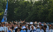 Argentine fans participate in a flag-waving event at Klyde Warren Park in Dallas, United S...