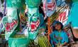 Participants wearing traditional Phi Ta Khon masks take part in a parade during the Phi Ta...