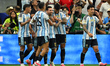 Lionel Messi of Argentina scores his team's first goal during the FIFA World Cup Group J m...