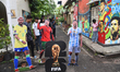 Enthusiasts wearing Argentina's No. 10 jersey with the name of Lionel Messi stand in front...