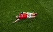 Konrad Laimer of Austria lies injured on the ground during the 2026 World Cup at AT&T Stad...