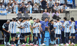 Lionel Scaloni, head coach of Argentina, talk to Lionel Messi of Argentina during the FIFA...