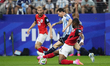 Lionel Messi of Argentina and Kevin Danso of Austria compete for the ball during the FIFA...