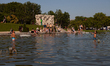 People cool off in the Warsaw Fountain pool at the Trocadero Gardens, opposite the Eiffel...