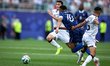 Kylian Mbappe of France battles for possession with Amir Alammari of Iraq during the FIFA...