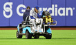 Chicago Cubs starting pitcher Edward Cabrera #30 is taken off the field by emergency medic...