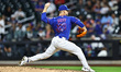 New York Mets relief pitcher A.J. Minter #33 throws during the ninth inning of a baseball...