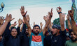 Kashmiri Shia Muslim mourners participate in a Muharram procession, shouting slogans, in S...