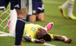 Vinicius Junior of Brazil lies on the field during the FIFA World Cup Group C match betwee...