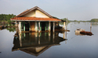 A residential house is partially submerged by encroaching seawater in Pekalongan, Central...