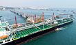 An oil tanker unloads imported crude oil at the crude oil terminal of Qingdao Port in Qing...