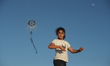 Palestinian children play on the seashore near Al-Shati Refugee Camp, west of Gaza City, o...
